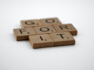 scrabble tiles that spell out Go For It